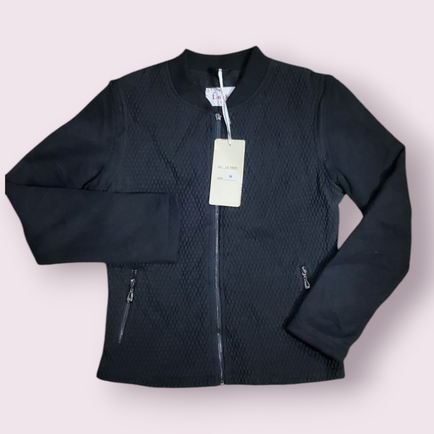 Women's bomber jacket with a textured diamond pattern and a full zip closure.