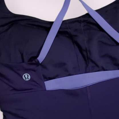 Lululemon Women's tank top with a built-in bra and criss-cross straps in blue and black colors.